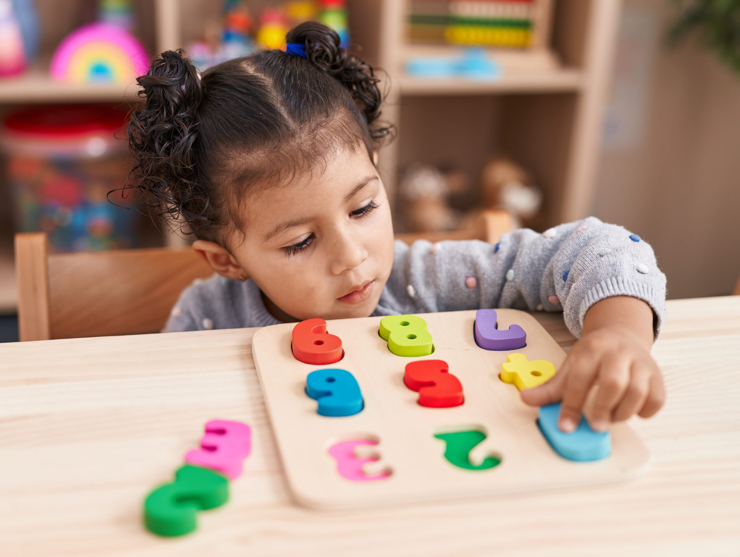Montessori curriculum classroom with children learning through hands-on activities